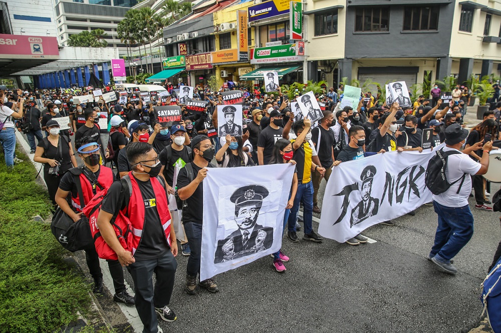Protesters hold banners and placards during the #TangkapAzamBaki rally in Kuala Lumpur January 22, 2022. u00e2u20acu2022 Picture by Yusof Mat Isa