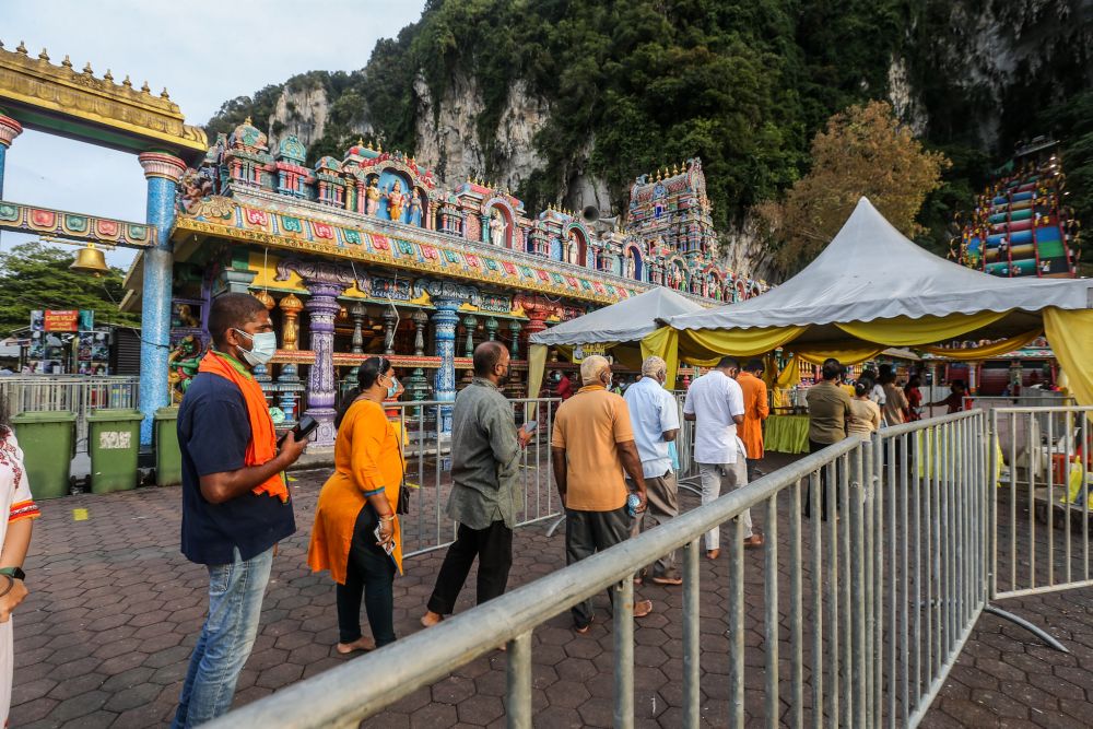 Hindu devotees observe standard operating procedures during Thaipusam at Batu Caves January 18, 2022. u00e2u20acu201d Picture by Hari Anggara