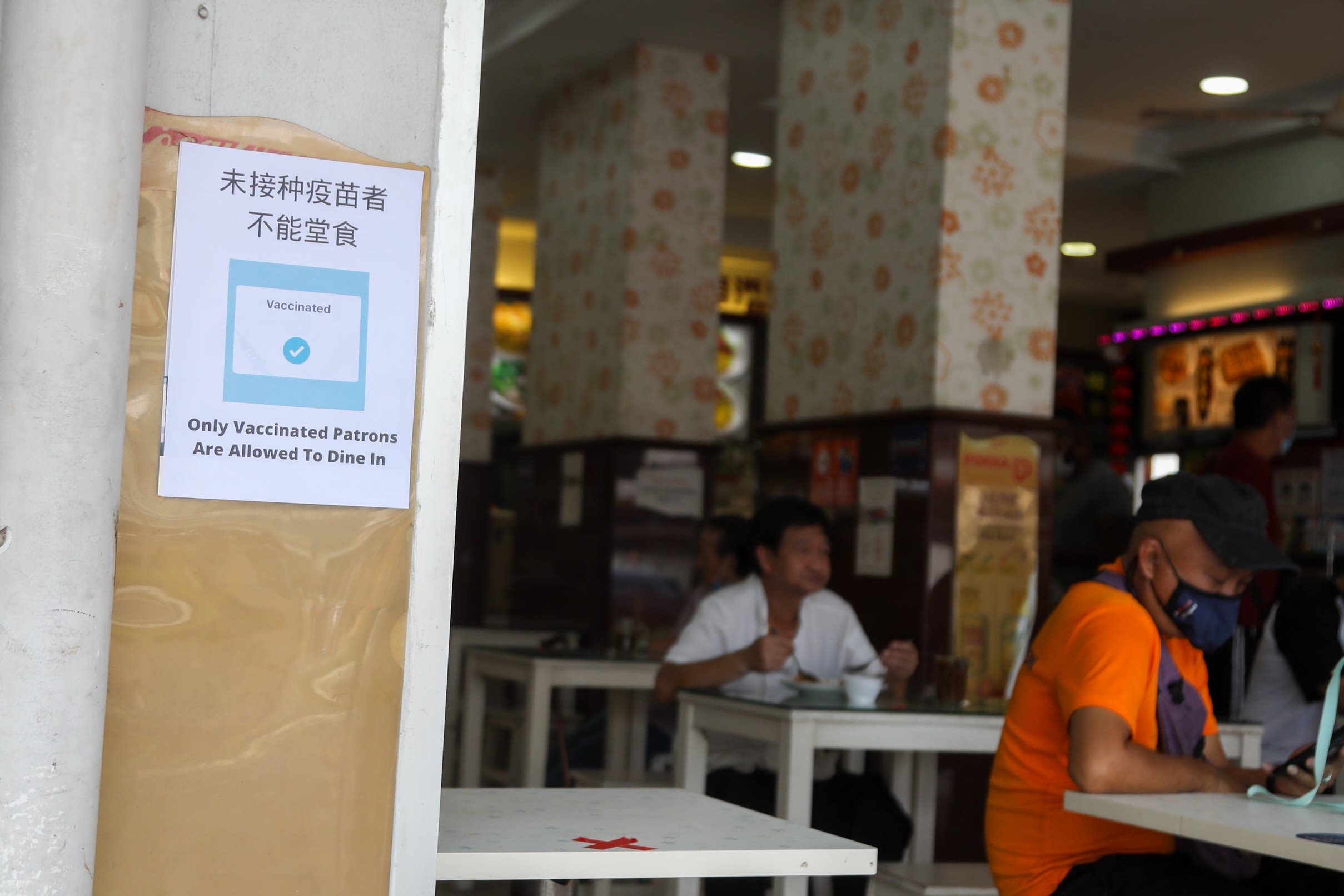 Coffee shops and hawker centres must put up posters informing patrons that only fully vaccinated customers are allowed to have their meals there. u00e2u20acu2022 TODAY pic
