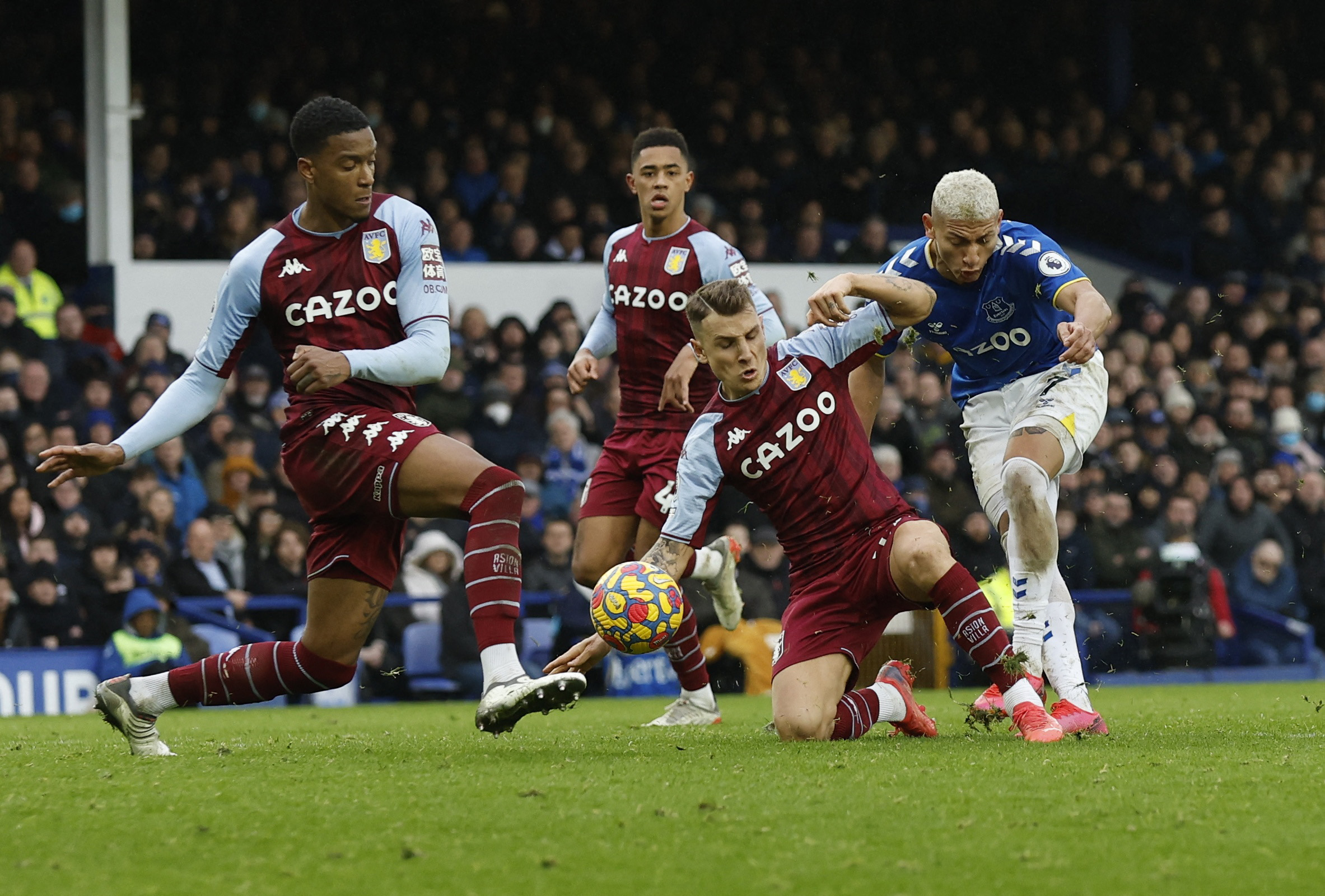 Aston Villau00e2u20acu2122s Ezri Konsa and Lucas Digne in action with Evertonu00e2u20acu2122s Richarlison during their Premier League match at Goodison Park, Liverpool, January 22, 2022. u00e2u20acu201d Action Images via Reuters