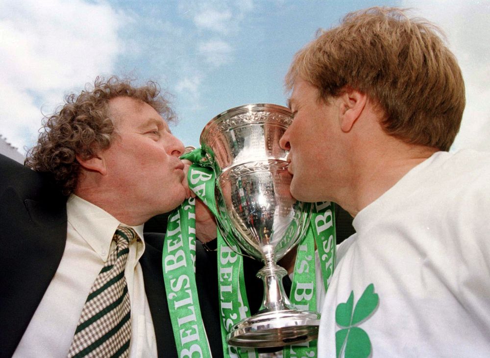 Celtic manager Wim Jansen (left) and his assistant Murdo McLeod kiss the Scottish Premier trophy May 9, 1998. u00e2u20acu201d Reuters pic
