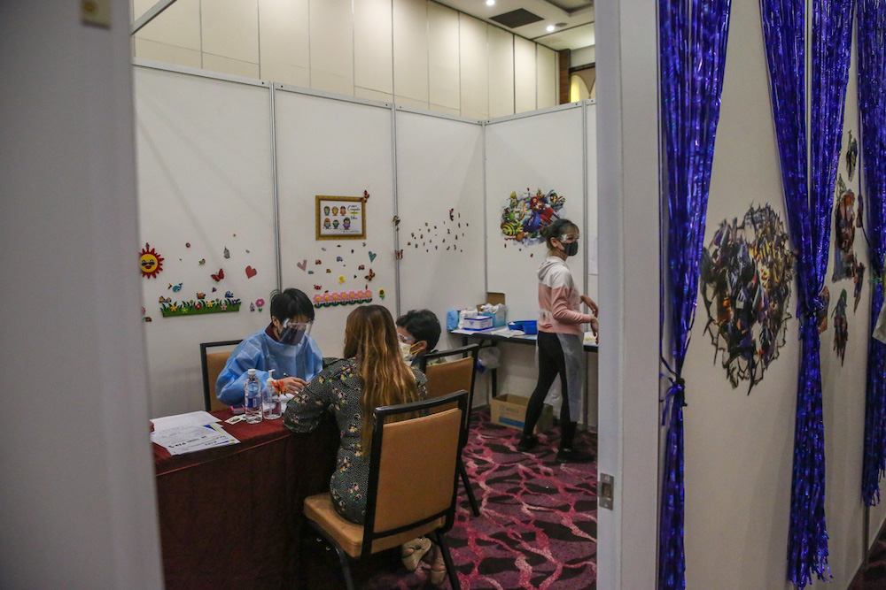 Children aged between five and 12 years wait to get their Covid-19 vaccine during the National Covid-19 Immunisation Programme for Kids (PICKids) at Ideal Convention Centre (IDCC) in Shah Alam January 3, 2022. u00e2u20acu201d Picture by Yusof Mat Isa