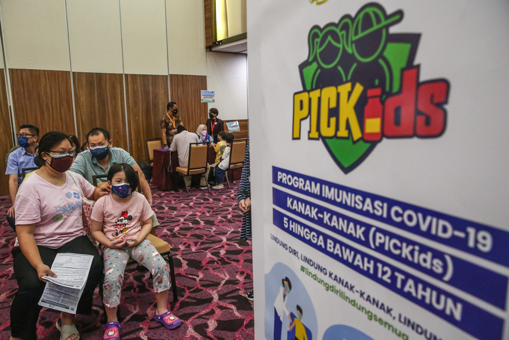 Children aged between five and 12 years wait to get their Covid-19 vaccine during the National Covid-19 Immunisation Programme for Kids (PICKids) at Ideal Convention Centre (IDCC) in Shah Alam January 3, 2022. u00e2u20acu201d Picture by Yusof Mat Isa