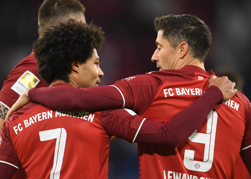 Bayern Munich's Serge Gnabry and Robert Lewandowski celebrate their third goal an own goal scored by RB Leipzig's Josko Gvardiol, February 6, 2022. u00e2u20acu201d Reuters/Andreas Gebert DFL pic