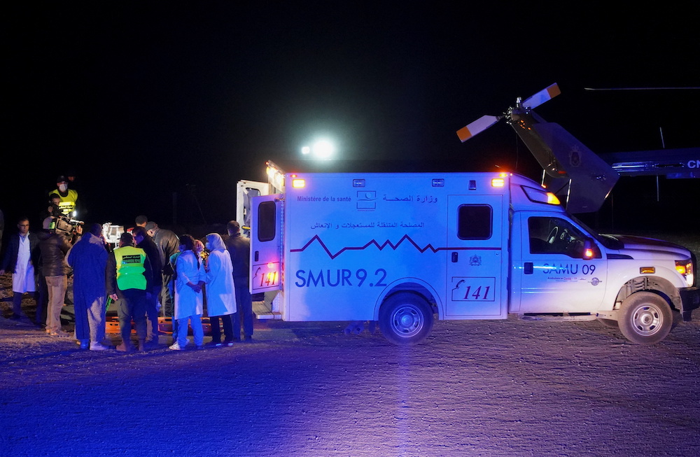 Medics and people inspect the body of five-year-old child, Rayan Awram, as they stand near an ambulance, near Chefchaouen, northern Morocco February 5, 2022. u00e2u20acu201d Reuters pic 