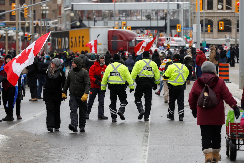 Police officers walk in the crowd, as truckers and supporters continue to protest Covid-19 vaccine mandates, in Ottawa, Ontario, Canada February 6, 2022. u00e2u20acu201d Reuters pic