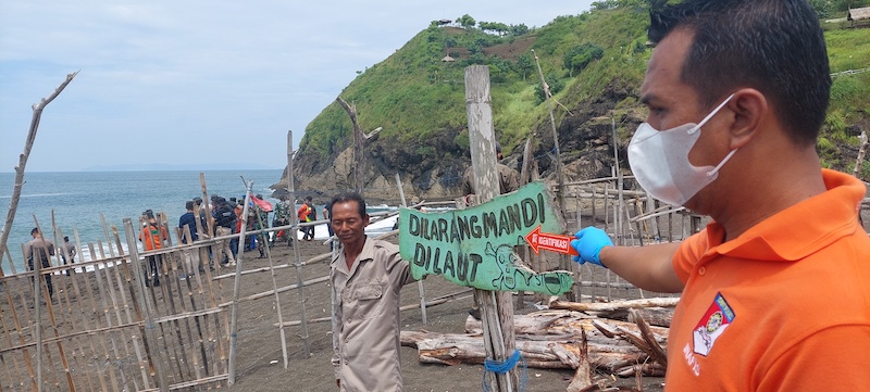 Indonesian police conduct a reconstruction to investigate an accident that killed ten people during a beach ritual in Jember, East Java February 13, 2022. u00e2u20acu201d AFP pic