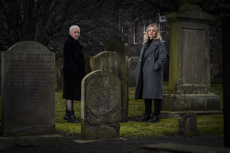 Founder of the association u00e2u20acu02dcWitches of Scotlandu00e2u20acu2122 Claire Mitchell and member Zoe Venditozzi pose for pictures in the Howff Cemetery in Dundee, Scotland January 30, 2022. u00e2u20acu201d AFP pic