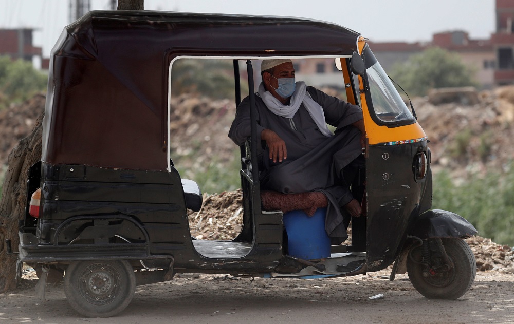 A tuk-tuk driver wearing a protective face mask to prevent the spread of the coronavirus disease takes a nap as he waits for customers, in Abu Kabir, Sharqia Governorate, north of Cairo, Egypt June 13, 2020. u00e2u20acu201d Reuters pic