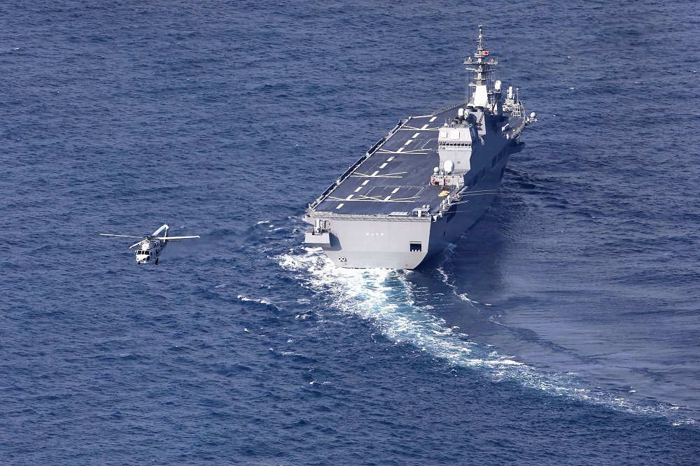 Japanu00e2u20acu2122s Maritime Self-Defence Forceu00e2u20acu2122s vessel Hyuga and helicopter conduct search operations for missing F-15 fighter jet, in Komatsu, Japan February 1, 2022. u00e2u20acu201d Picture by Kyodo via Reuters