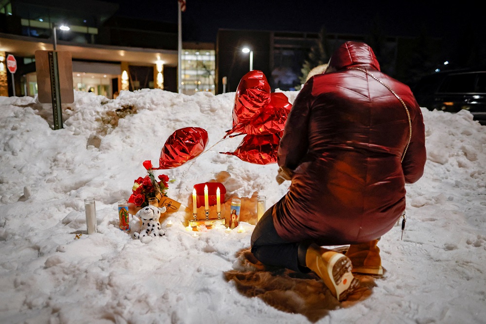 A community member lights candles to mourn the death of Jahmari Rice, who was shot and killed outside of the South Education Centre school, in Richfield, Minnesota February 1, 2022.  u00e2u20acu201d Reuters pic