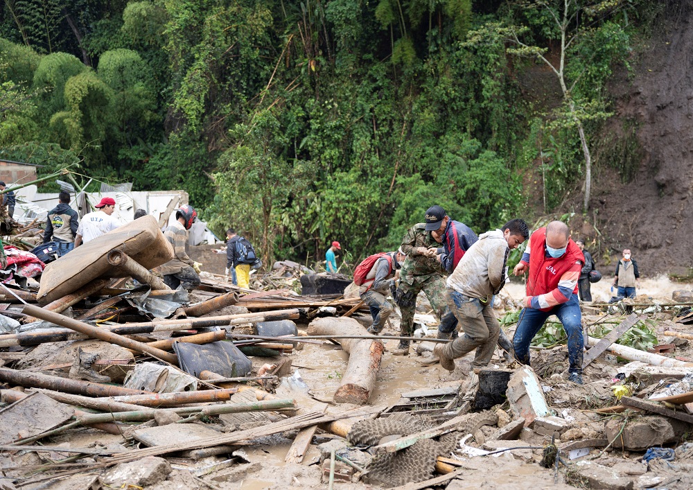 People remove debris following a landslide caused by heavy rains, that killed and injured residents and destroyed homes, in Pereira, Colombia February 8, 2022. u00e2u20acu201d Reuters pic