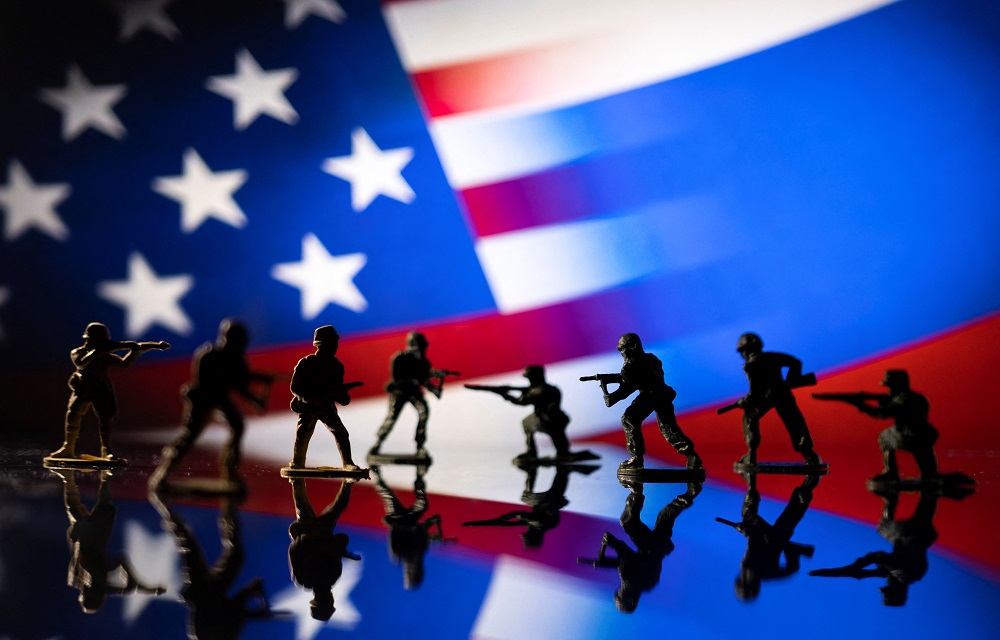 Army soldier figurines are displayed in front of the US and Russian flag colours background in this illustration taken February 13, 2022. u00e2u20acu201d Reuters pic