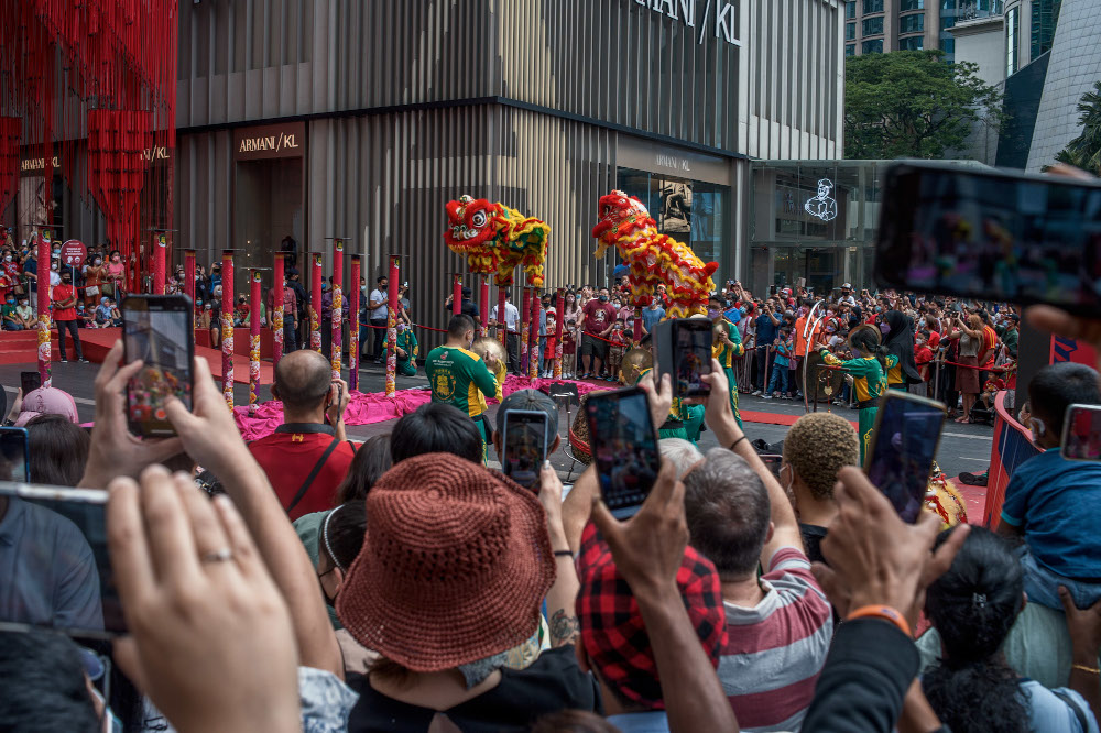 Large crowds gathered outside Pavillion Mall in Kuala Lumpur to catch a glimpse of the lion dance performances on the first day of the 2022 CNY celebrations in Kuala Lumpur February 1, 2022. — Picture by Shafwan Zaidon