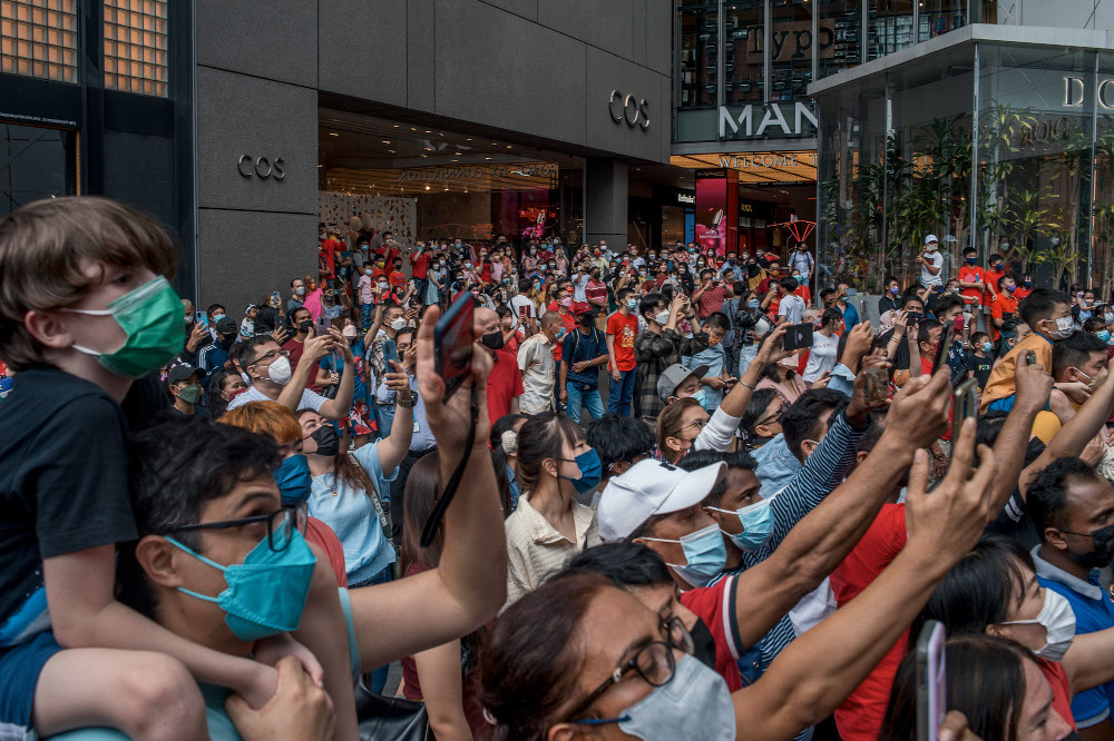 Large crowds gathered outside Pavillion Mall in Kuala Lumpur to catch a glimpse of the lion dance performances on the first day of the 2022 CNY celebrations in Kuala Lumpur February 1, 2022. — Picture by Shafwan Zaidon