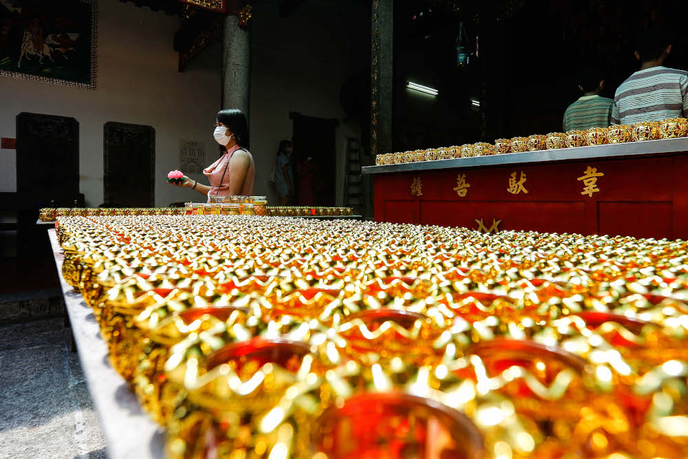 Devotees visit the Goddess of Mercy Temple to offer their prayer during Chinese New Year celebration at Jalan Kapitan Keling, Penang February 1, 2022. — Picture by Sayuti Zainudin