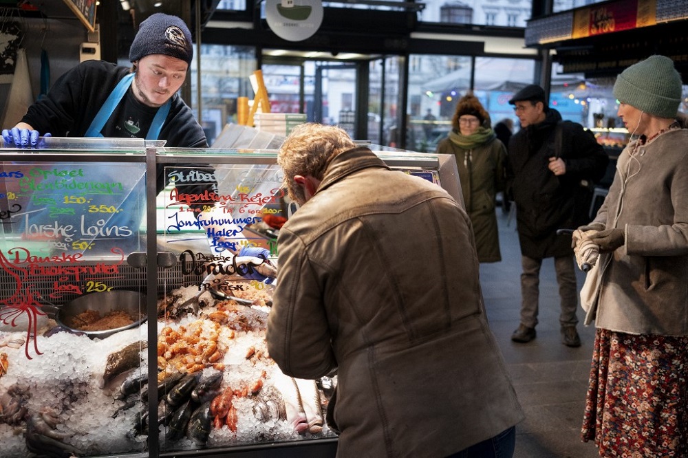 Customers are pictured at the fishmarket in Torvehallerne in Copenhagen February 1, 2022. u00e2u20acu201d AFP pic
