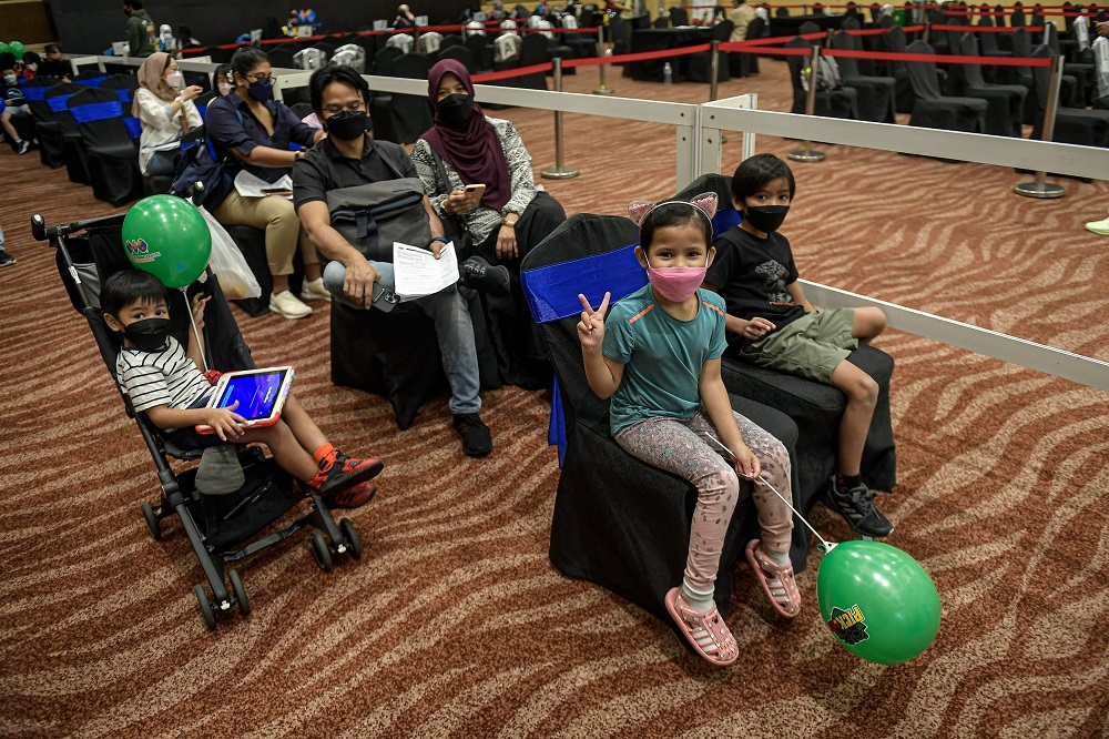 File photo shows children accompanied by their parents waiting to receive the Covid-19 vaccine at the World Trade Centre Kuala Lumpur on Feb 3, 2022. u00e2u20acu201d Bernama pic