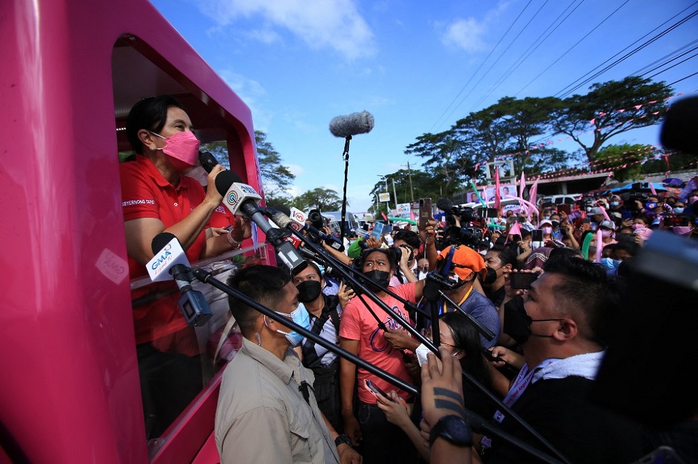 Philippine Vice President and opposition presidential candidate Leni Robredo (left) speaks from a truck during a campaign rally in the town of Libamanan, Camarines Sur province, south of Manila February 8, 2022. u00e2u20acu201d AFP pic