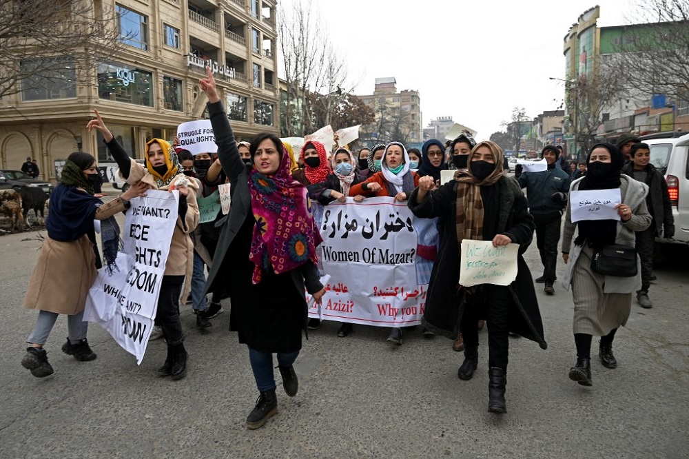 Afghan women chant slogans and hold banners during a women's rights protest march in Kabul January 16, 2022. u00e2u20acu201d AFP pic