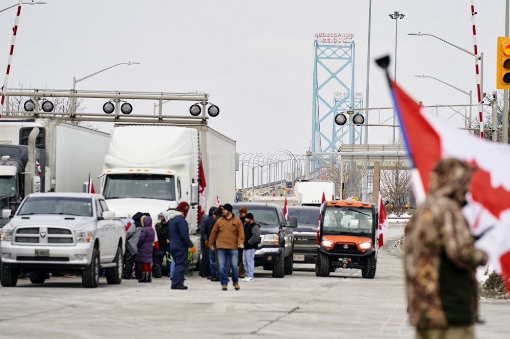 Supporters of the Truckers Convoy against the Covid-19 vaccine mandate block traffic in the Canada bound lanes of the Ambassador Bridge border crossing, in Windsor, Ontario February 8, 2022. u00e2u20acu201d AFP pic