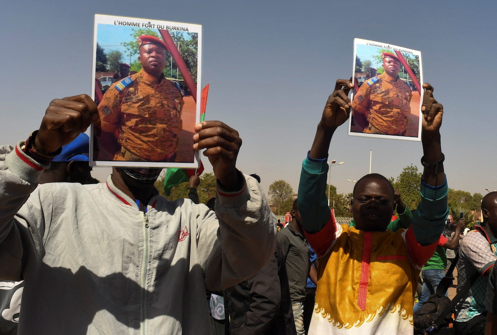 Men hold a photograph of the lieutenant colonel Paul-Henri Sandaogo Damiba, in Burkina Faso, Ouagadougou January 25, 2022. u00e2u20acu201d Reuters pic 