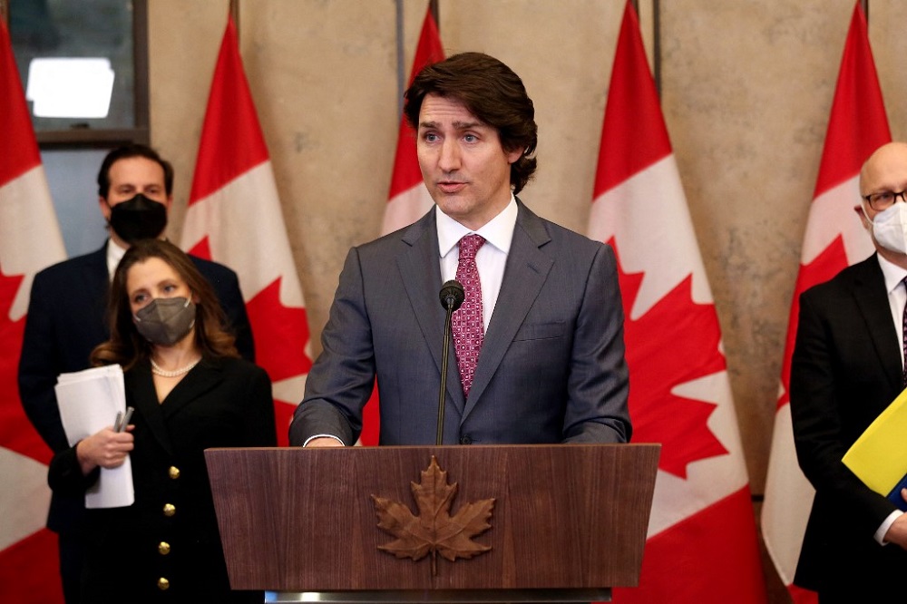 Canadau00e2u20acu2122s Prime Minister Justin Trudeau (centre) comments on the ongoing truckers mandate protest during a news conference on Parliament Hill in Ottawa February 14, 2022. u00e2u20acu201d AFP pic