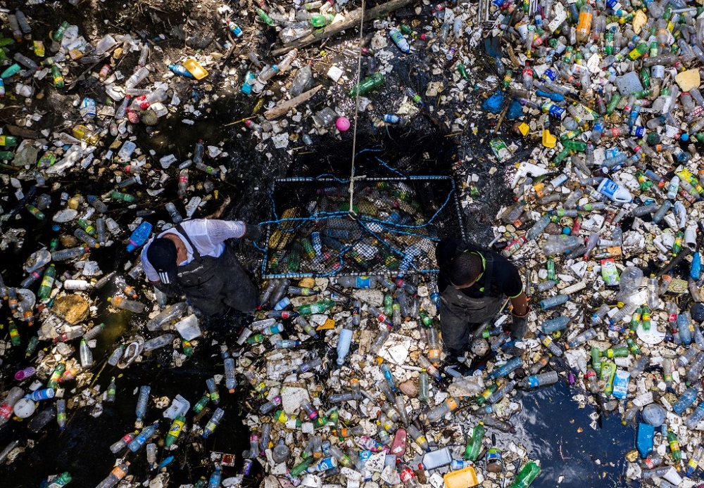 Workers collect garbage, including plastic waste, at the Matias Hernandez River in Costa del Este, Panama City in this file photo taken September 23, 2019. u00e2u20acu201d AFP pic