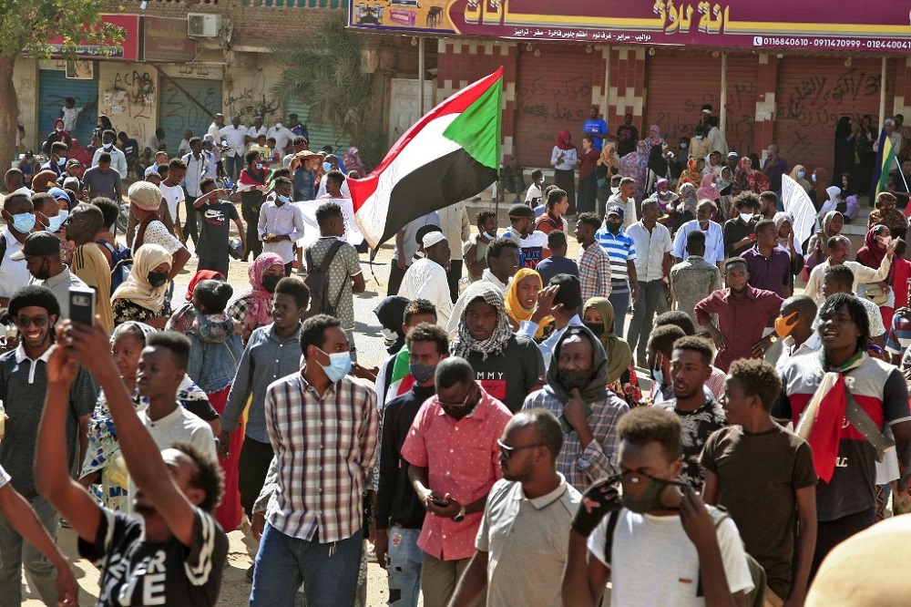Sudanese protesters march during a demonstration calling for civilian rule and denouncing the military administration, in the capital Khartoum's twin city of Umdurman February 14, 2022. u00e2u20acu201d AFP pic