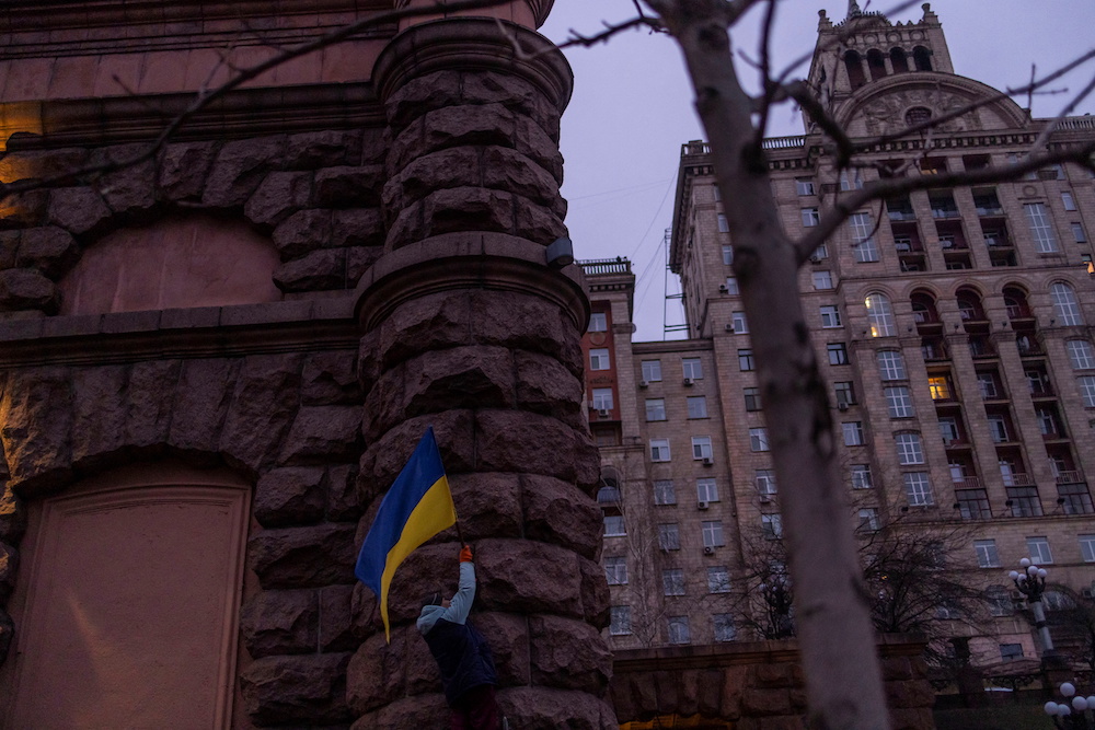 A man installs a Ukrainian flag at a building in downtown Kyiv, Ukraine February 16, 2022. u00e2u20acu201d Reuters pic