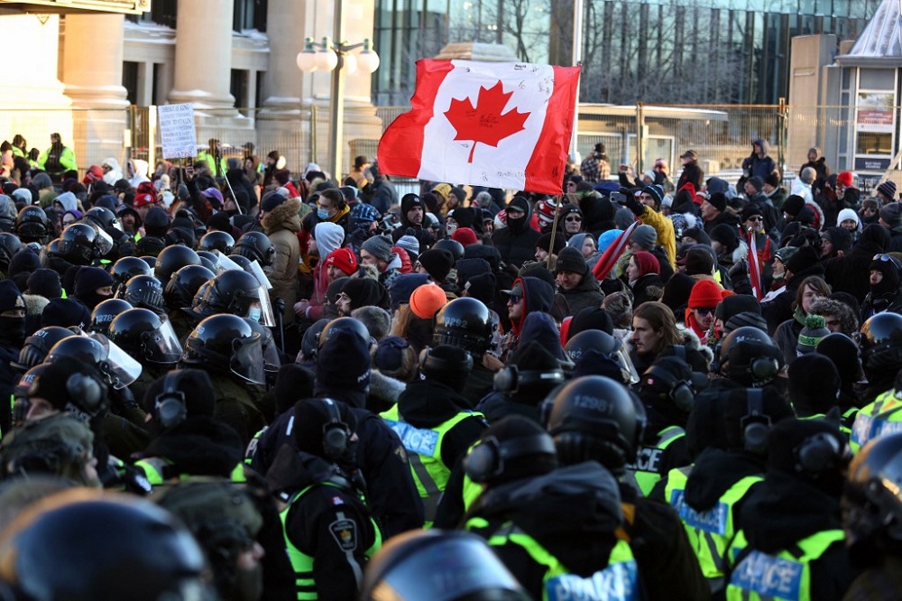 nProtesters block a police line during a protest against Covid-19 mandates in Ottawa February 18, 2022. u00e2u20acu201d AFP picn