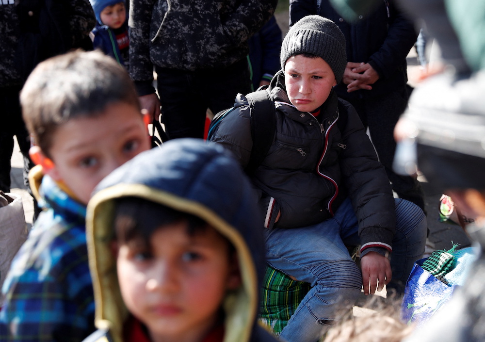 People fleeing from Ukraine to Hungary arrive at the train station, after Russia launched a massive military operation against Ukraine, in Zahony, Hungary, February 27, 2022. u00e2u20acu201d Reuters pic