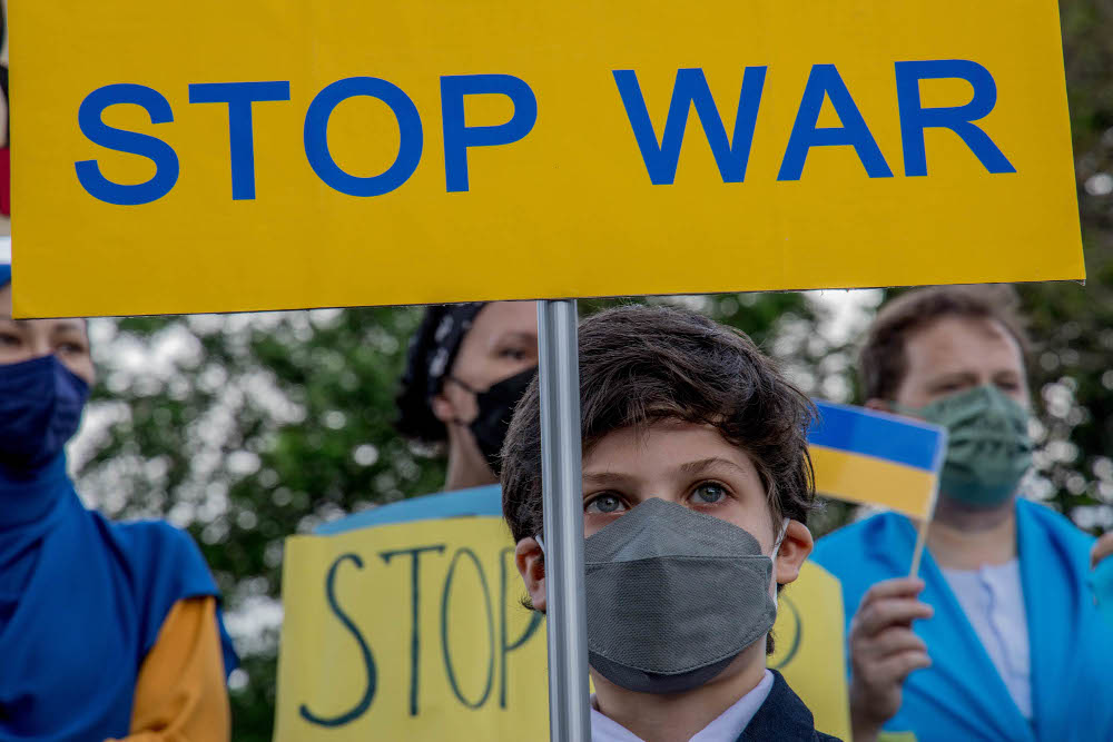 Demonstrators hold placards during a protest against Russiau00e2u20acu2122s invasion of Ukraine, in front of the Russian embassy in Kuala Lumpur on February 28, 2022. u00e2u20acu201d Picture by Firdaus Latif 