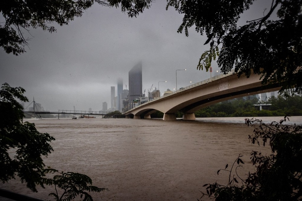 The overflowing Brisbane River is seen from South Bank, Australiau00e2u20acu2122s Queensland state February 27, 2022. u00e2u20acu201d AFP pic