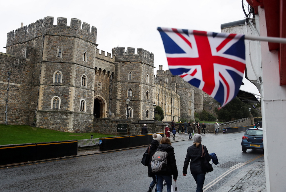 People gather outside Windsor Castle after it was announced that Britain's Queen Elizabeth tested positive for Covid-19, in Windsor, Britain February 20, 2022. u00e2u20acu201d Reuters pic 