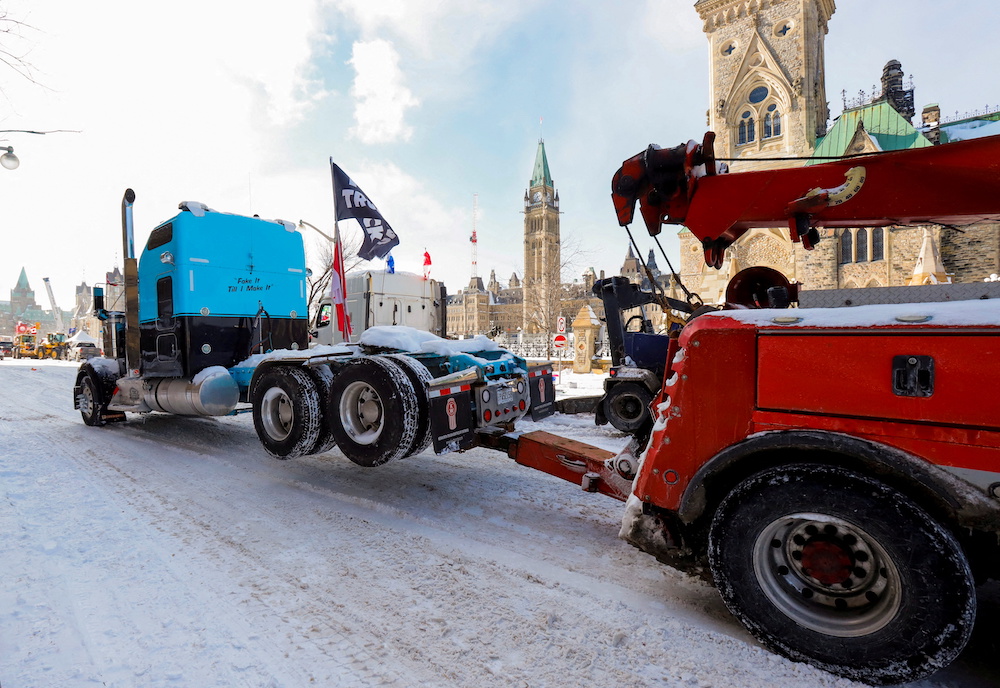 A truck is towed from in front of Parliament Hill as Canadian police work to restore normality after trucks and demonstrators occupied the capital for more than three weeks to protest against Covid restrictions in Ottawa February 19, 2022. u00e2u20acu201d Reuters pic