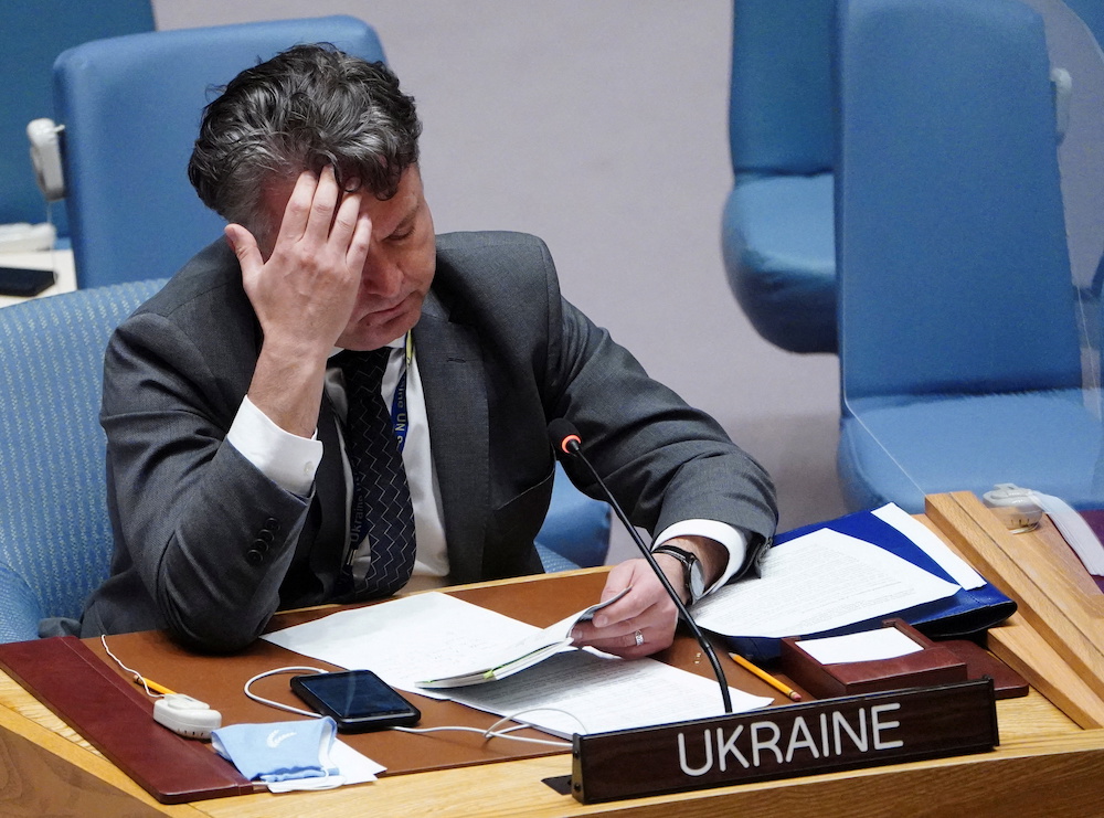 Ukrainian Ambassador to the United Nations Sergiy Kyslytsya reads a copy of the UN Charter during the United Nations Security Council meeting to discuss the ongoing crisis in Ukraine with Russia, in New York City February 24, 2022. u00e2u20acu201d Reuters pic