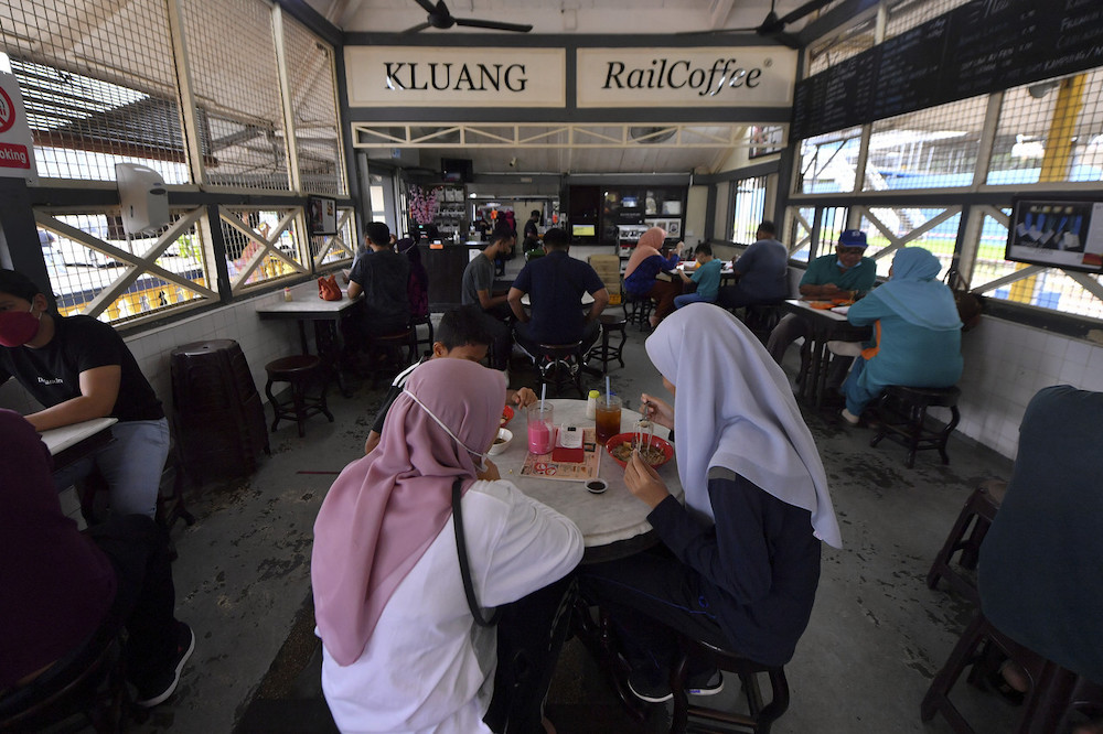 Customers enjoying their meal at Kluang Rail Coffee in Kluang February 27, 2022. u00e2u20acu201d Bernama pic