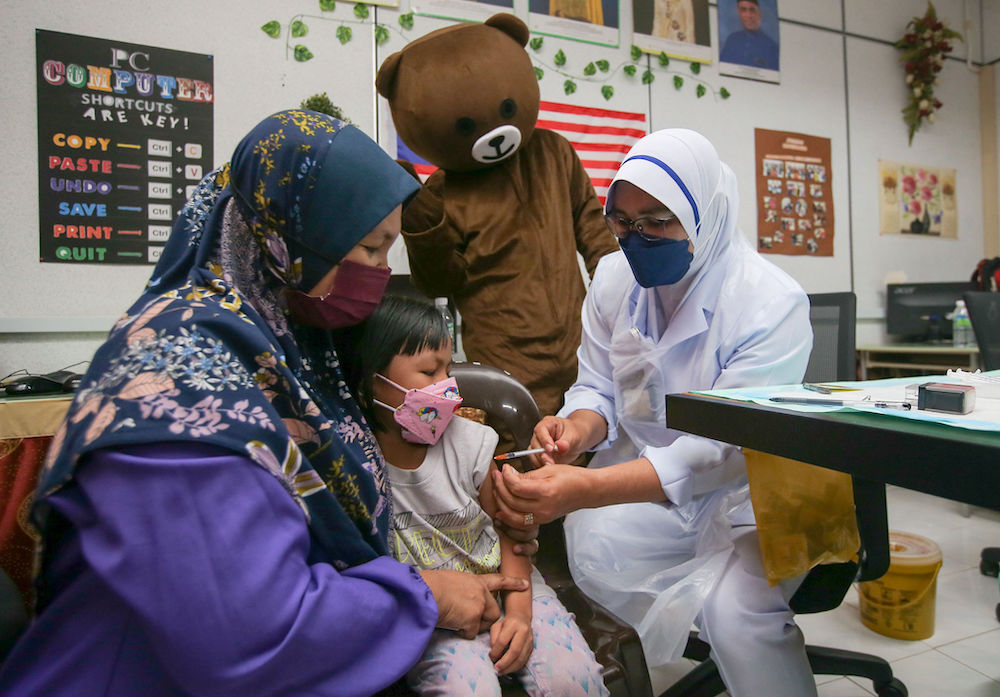 Children get their Covid-19 vaccination at a kindergarten in Parit, Perak February 28, 2022. u00e2u20acu201d Picture by Farhan Najib