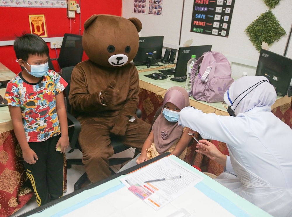 Children get their Covid-19 vaccination at a kindergarten in Parit, Perak February 28, 2022. u00e2u20acu201d Picture by Farhan Najib