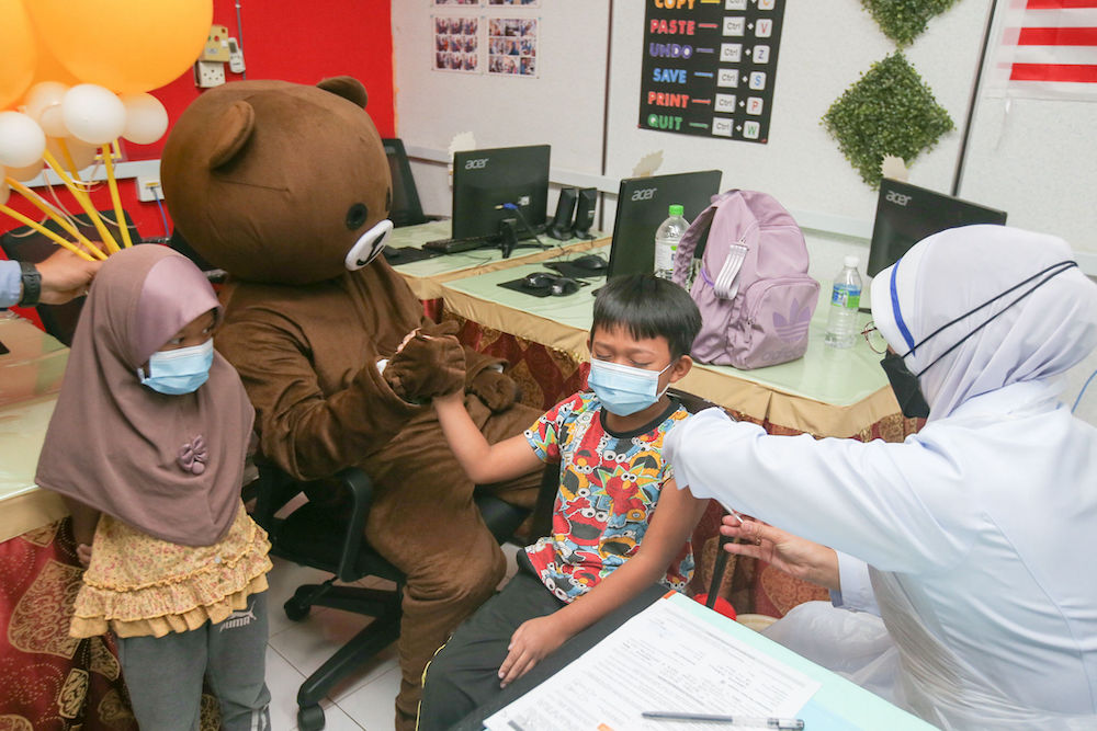 Children get their Covid-19 vaccination at a kindergarten in Parit, Perak February 28, 2022. u00e2u20acu201d Picture by Farhan Najib