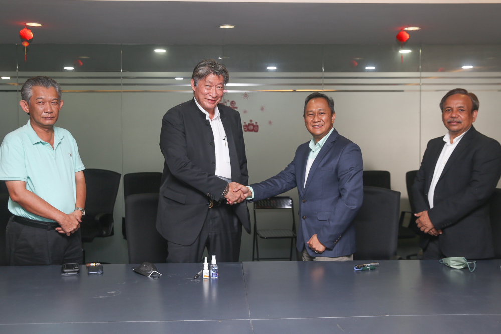(From left) Datuk Hasnul Hassan, Datuk Siew Ka Wei, Joe Pramesh Ganesaguru and Sabli Sibil at the signing ceremony at Ancom Berhad, Petaling Jaya, February 22, 2022. u00e2u20acu2022 Picture by Choo Choy May