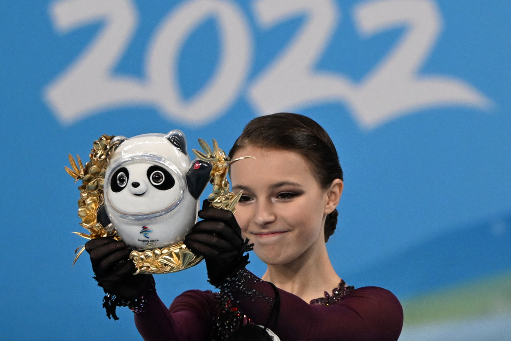 Gold medallist Russiau00e2u20acu2122s Anna Shcherbakova celebrates on the podium of the womenu00e2u20acu2122s single skating figure skating event at the Capital Indoor Stadium in Beijing on February 17, 2022. u00e2u20acu201d AFP picnn