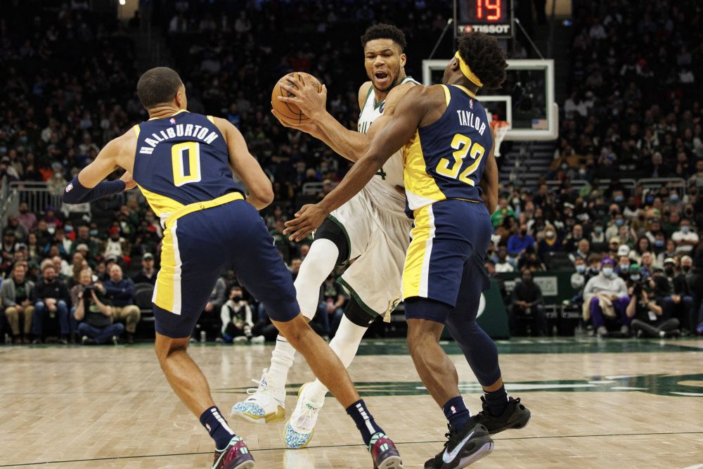 Milwaukee Bucks forward Giannis Antetokounmpo (34) drives for the basket between Indiana Pacers guard Tyrese Haliburton (0) and forward Terry Taylor (32) at the Fiserv Forum, Milwaukee February 15, 2022. u00e2u20acu201d Reuters picnn
