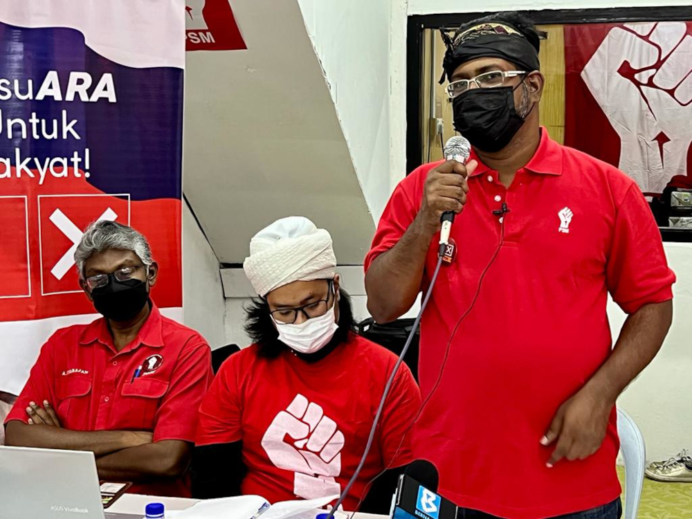 Parti Sosialis Malaysiau00e2u20acu2122s (PSM) Kota Iskandar candidate Arangkannal Rajoo (right) at the announcement of his candidacy at a shophouse in Kangkar Tebrau in Iskandar Puteri, February 21, 2022. u00e2u20acu201d Picture by Ben Tan
