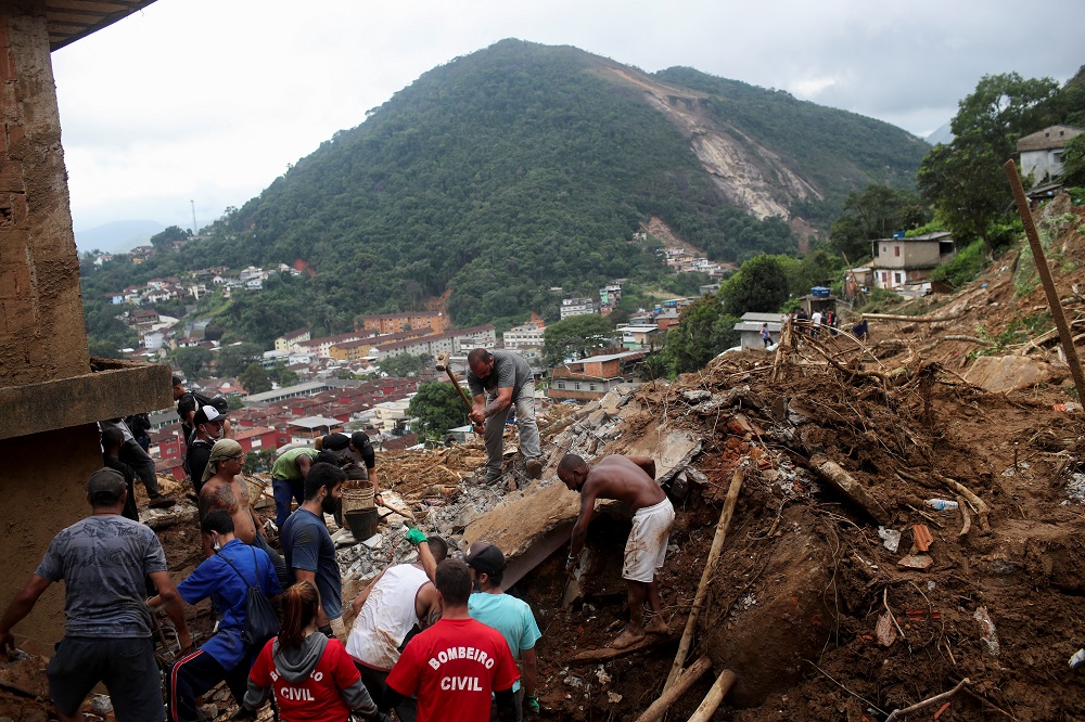 People work at the site of a mudslide at Morro da Oficina after pouring rains in Petropolis, Brazil February 17, 2022. u00e2u20acu2022 Reuters pic