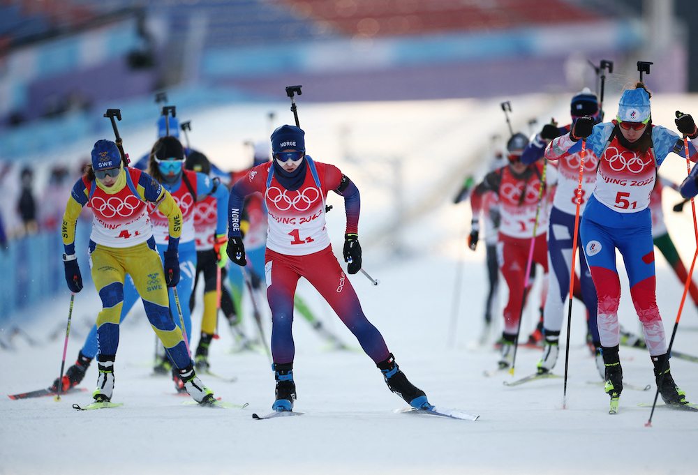 Athletes in action during the biathlon, mixed relay competition at the National Biathlon Centre in Zhangjiakou, China, February 5, 2022. u00e2u20acu2022 Reuters picnn
