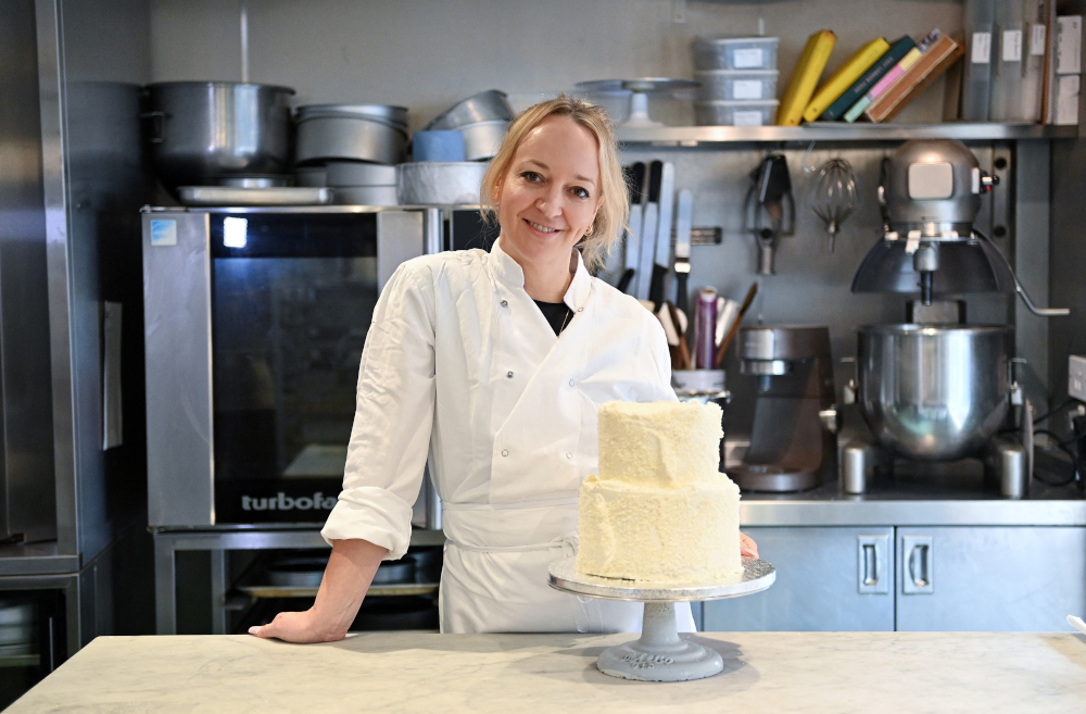 Baker Claire Ptak poses with her coconut pudding cake during an interview with AFP at her Violet Bakery in east London January 27, 2022. u00e2u20acu201d AFP picnn