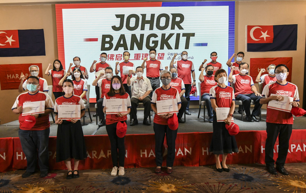 DAP secretary-general Lim Guan Eng (seated, 2nd row, centre) with the partyu00e2u20acu2122s candidates for the Johor state election in Johor Baru, February 24, 2022. u00e2u20acu201d Bernama pic 