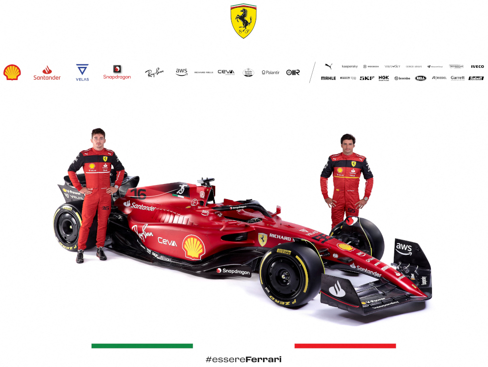 Ferrariu00e2u20acu2122s drivers Charles Leclerc (left) and Carlos Sainz posing next to the new Ferrari F1-75 following its online official presentation at Ferrari headquarters in Maranello, February 17, 2022. u00e2u20acu201d Ferrari Press Office handout pic via AFP 